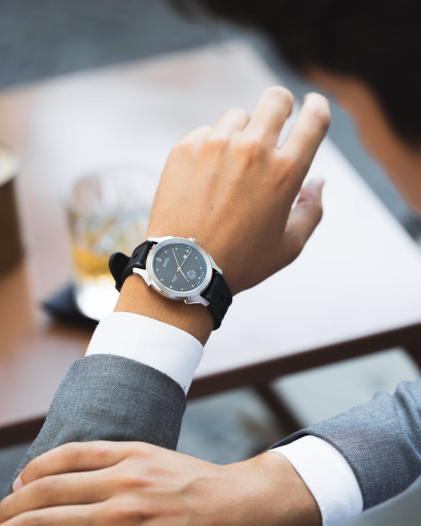 Young man in suit wears a good deign awarded BWG BAVARIA premium quartz watch with Swiss Made Ronda movement 