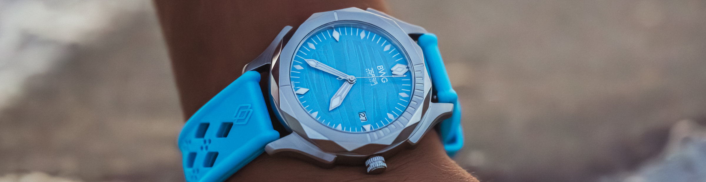 Title of BWG Bavarian Watch Watch Online Store showing the BWG ISARIA Automatic watch Swiss Movement Landeron L24 manufacture in sky blue on the beach